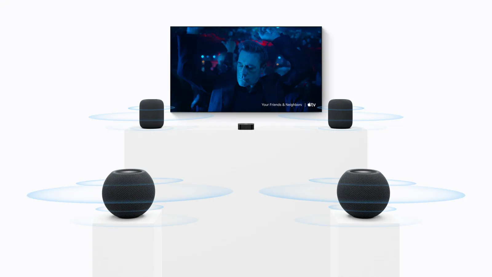 A home theater setup with two HomePod (2nd generation) speakers in the front and two HomePod mini 2 speakers in the rear.