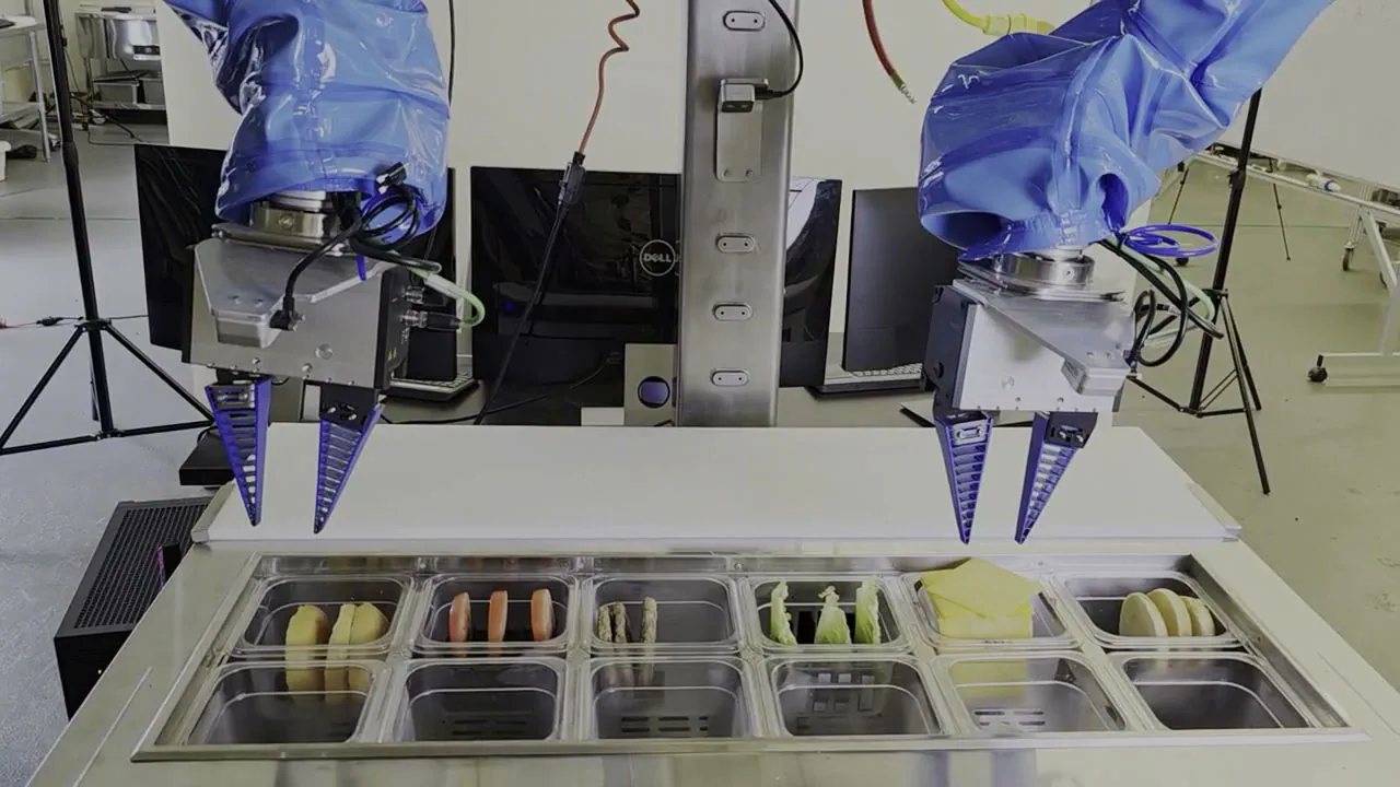 Partner demonstration footage or stills showing Almond’s Axol dual-arm robot deburring assembly spacers, with any displayed four-day iteration annotation.